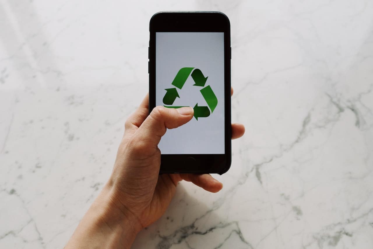 recycling sign on smartphone screen